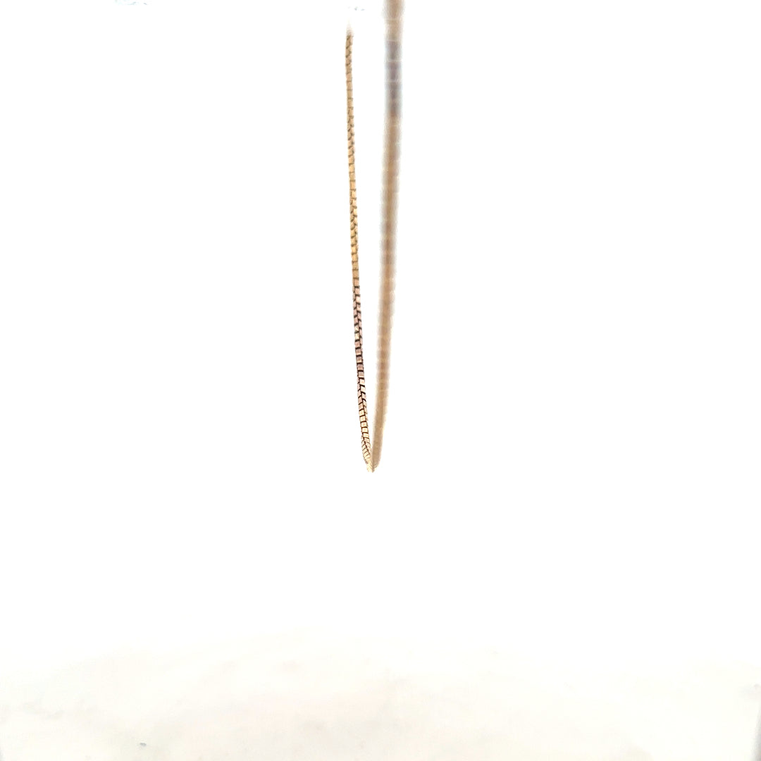 9ct yellow gold chain weighing 6.1g, unbranded jewelry accessory with a classic chain design, shown in close-up image.