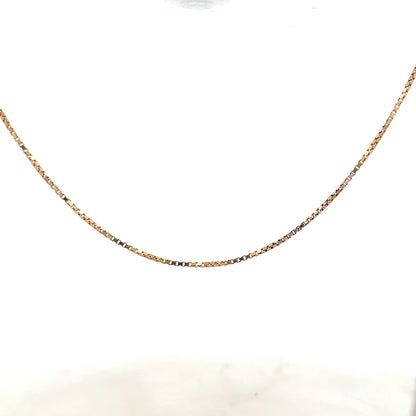 9ct yellow gold chain weighing 6.1g, unbranded, with a close-up view of its detailed link design.