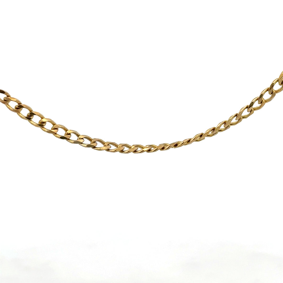9ct yellow gold chain weighing 7.4g, unbranded jewelry chain with a classic design, shown in a close-up image.
