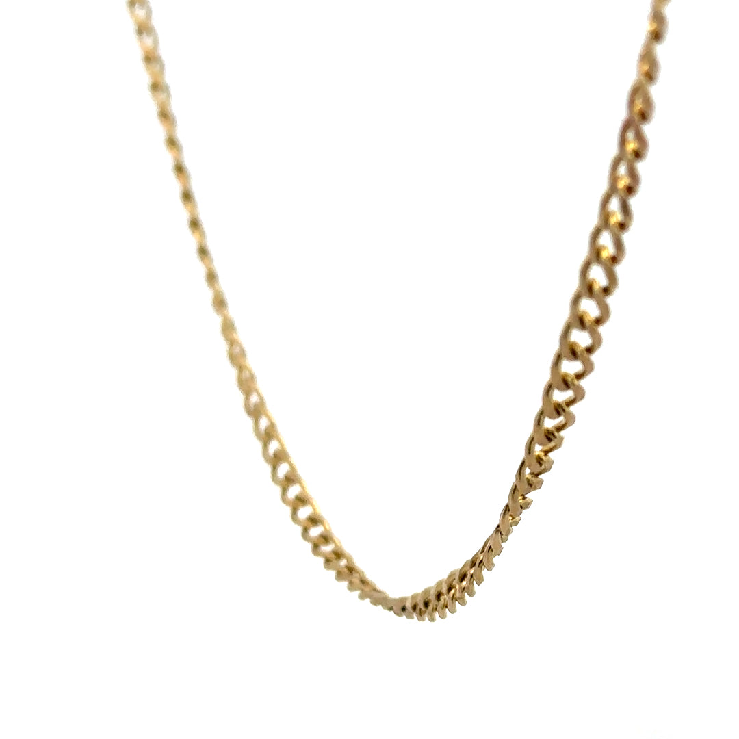 9ct yellow gold chain weighing 7.4g, unbranded jewelry chain with a classic design, shown in a close-up shot.