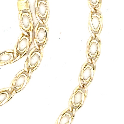 9ct yellow gold chain with a delicate link design, weighing 7.8 grams, featured in this unbranded jewelry image.