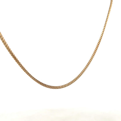 9ct yellow gold chain weighing 9.2g, unbranded, with a classic link design, shown in a close-up view highlighting the gold finish.