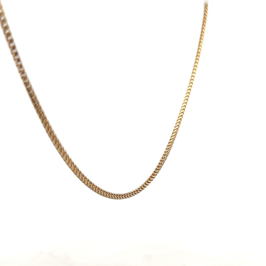 9ct yellow gold chain weighing 9.2g, unbranded jewelry chain with a polished finish, displayed on a neutral background.