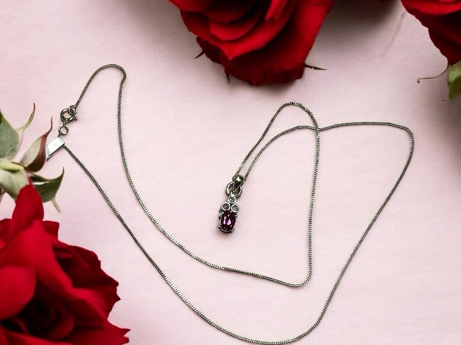 9ct yellow gold chain with diamond pendant, lightweight jewelry piece showcasing a delicate gold link chain and sparkling diamond.
