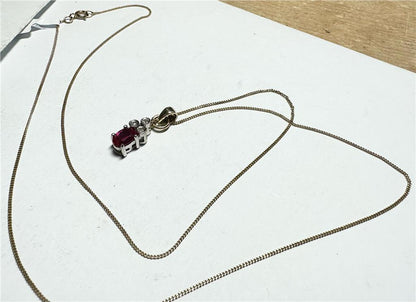 9ct yellow gold chain with a diamond pendant, showcasing a delicate design, weight 1.9g, unbranded jewelry accessory.