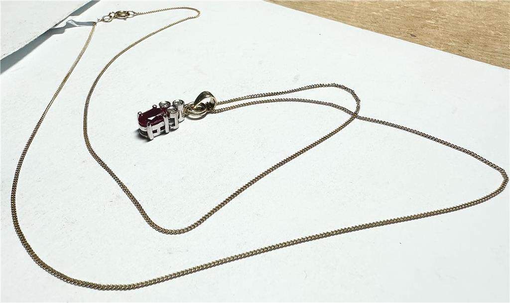 9ct yellow gold chain with diamond pendant, featuring a delicate design and sparkling gemstone, weighing 1.9g.