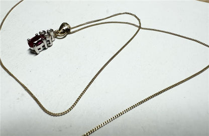 9ct yellow gold chain with diamond pendant, showcasing a delicate design and sparkling gemstone on a fine jewelry chain.