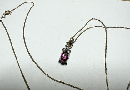 9ct yellow gold chain with diamond pendant, lightweight jewelry piece, featuring a delicate chain and sparkling diamond accent.