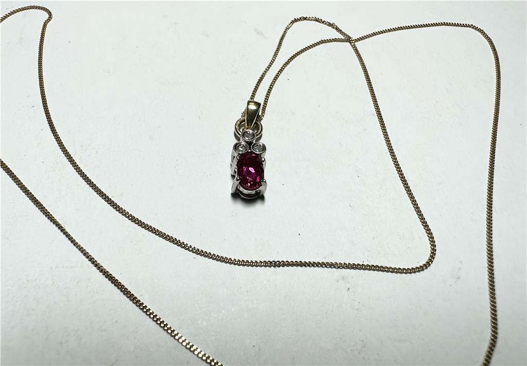 9ct yellow gold chain with diamond pendant, featuring a delicate design and sparkling diamonds, weighs 1.9 grams.