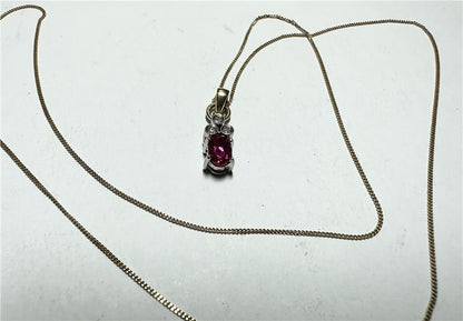 9ct yellow gold chain with diamond pendant, featuring a delicate design and sparkling diamonds, weighs 1.9 grams.