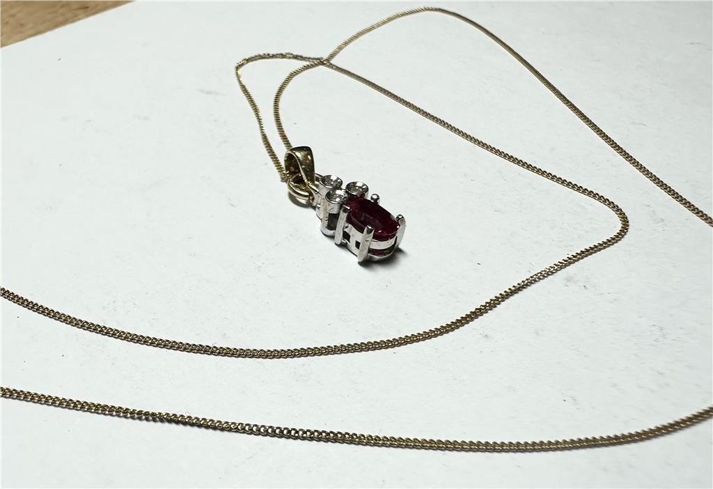 9ct yellow gold chain with diamond pendant, lightweight jewelry piece, featuring a delicate chain and sparkling diamond accent.