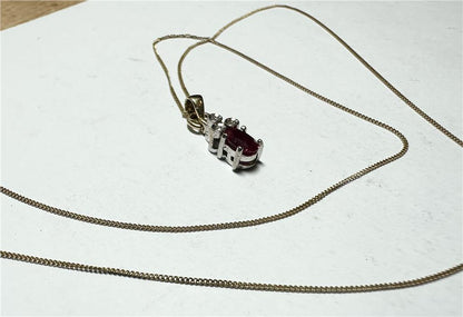 9ct yellow gold chain with diamond pendant, lightweight jewelry piece, featuring a delicate chain and sparkling diamond accent.