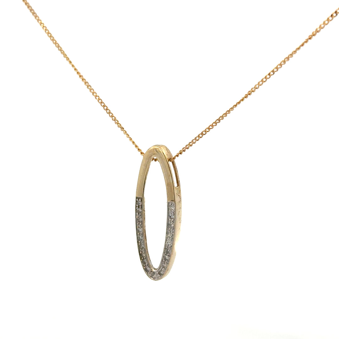 9ct yellow gold chain with diamond pendant, showcasing a delicate chain and sparkling diamond accent on a plain background.
