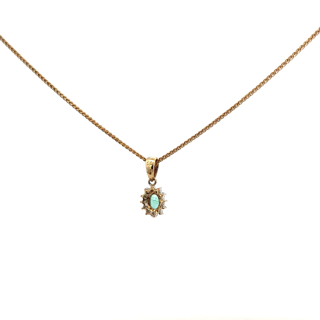 9ct yellow gold chain with emerald and diamond pendant, decorative jewelry featuring vibrant gemstones and elegant design.