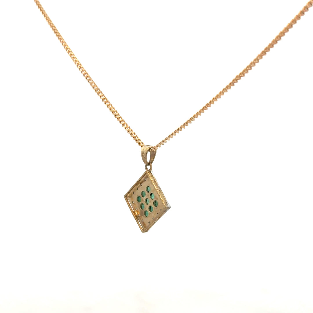 9ct yellow gold chain with emerald and diamond pendant, showcasing a detailed design and elegant gemstone accents.
