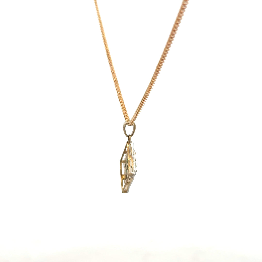 9ct yellow gold chain with emerald and diamond pendant, showcasing a delicate and elegant jewelry piece.