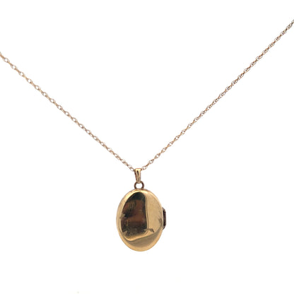 9ct yellow gold chain with a locket pendant, unbranded, weighing 2.9g, displayed on a neutral background.