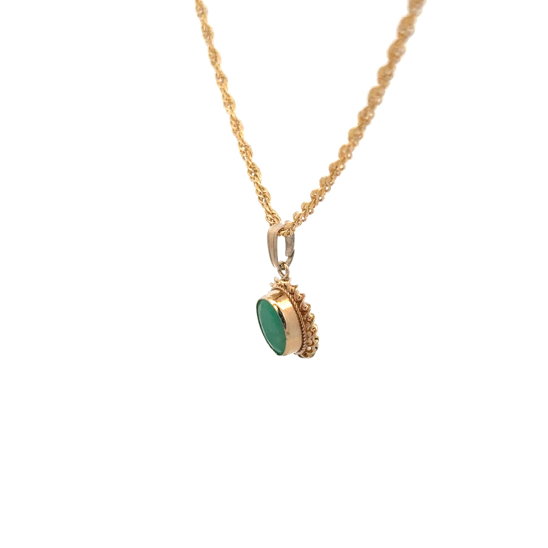 9ct yellow gold pendant with chain, unbranded, 4.6g, featuring a detailed design visible in the image.