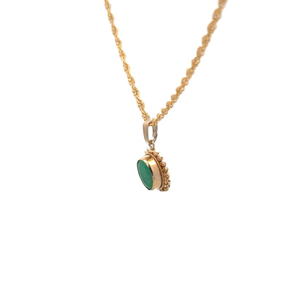 9ct yellow gold pendant with chain, unbranded, 4.6g, featuring a detailed design visible in the image.