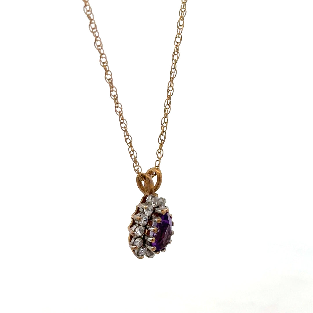 9ct yellow gold chain with pendant, lightweight jewelry piece weighing 1.9g, unbranded, close-up view of the gold chain and pendant.
