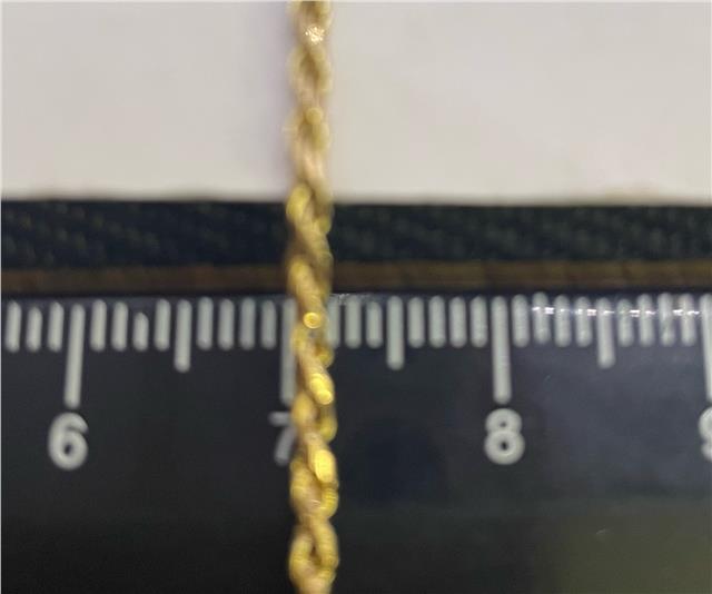 9ct yellow gold chain with a delicate link design, shown in this close-up image. Unbranded jewelry chain detail.