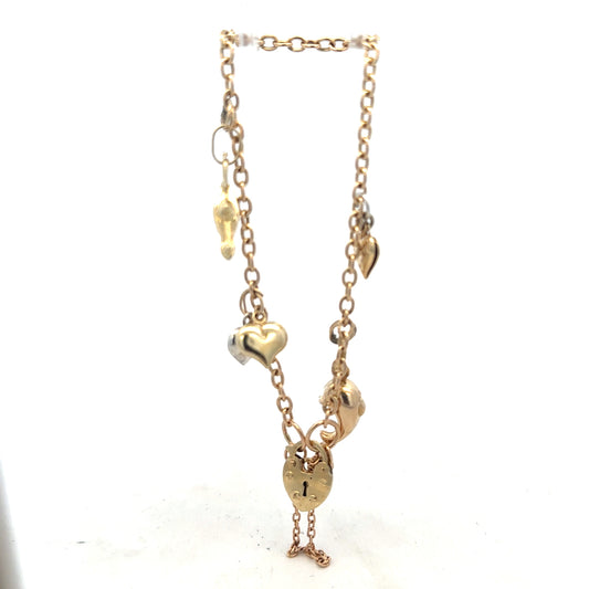 9ct yellow gold charm bracelet weighing 5.4g, unbranded, featuring delicate chain links and small decorative charms.