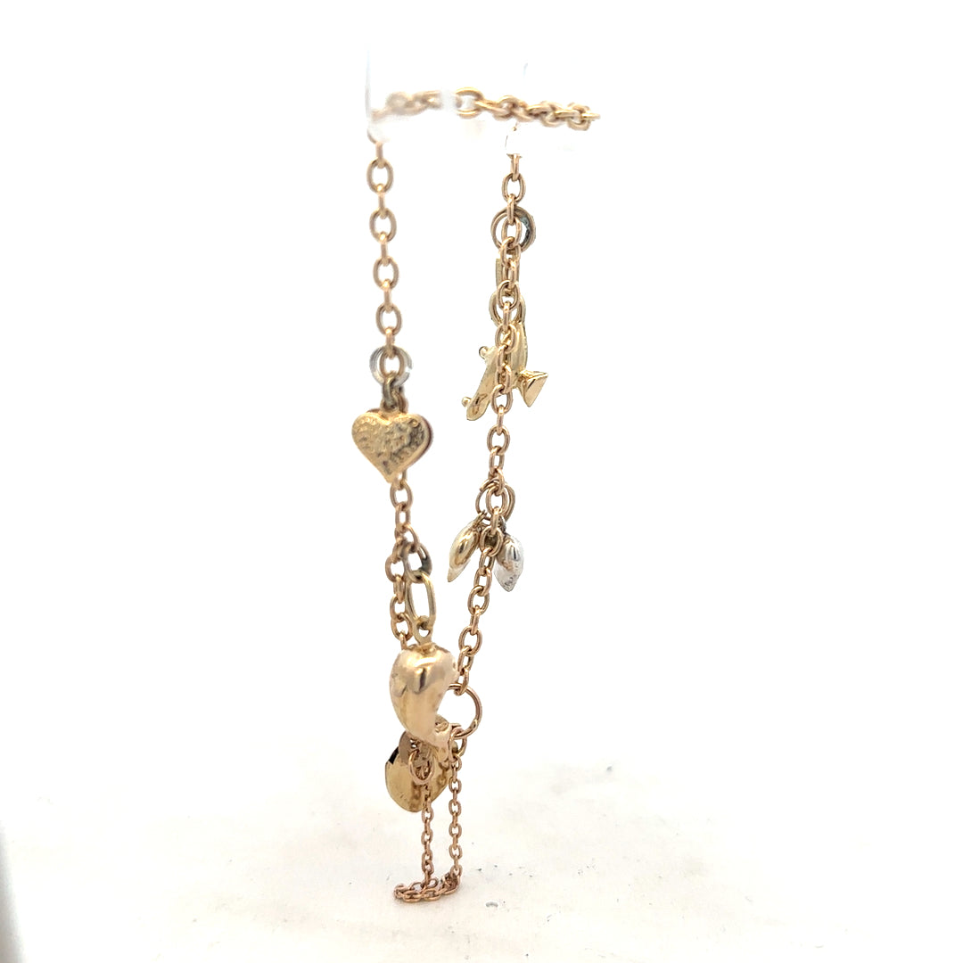 9ct yellow gold charm bracelet weighing 5.4g, unbranded, with decorative charms and a secure clasp.