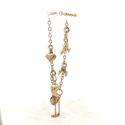 9ct yellow gold charm bracelet weighing 5.4g, unbranded, with decorative charms and a secure clasp.
