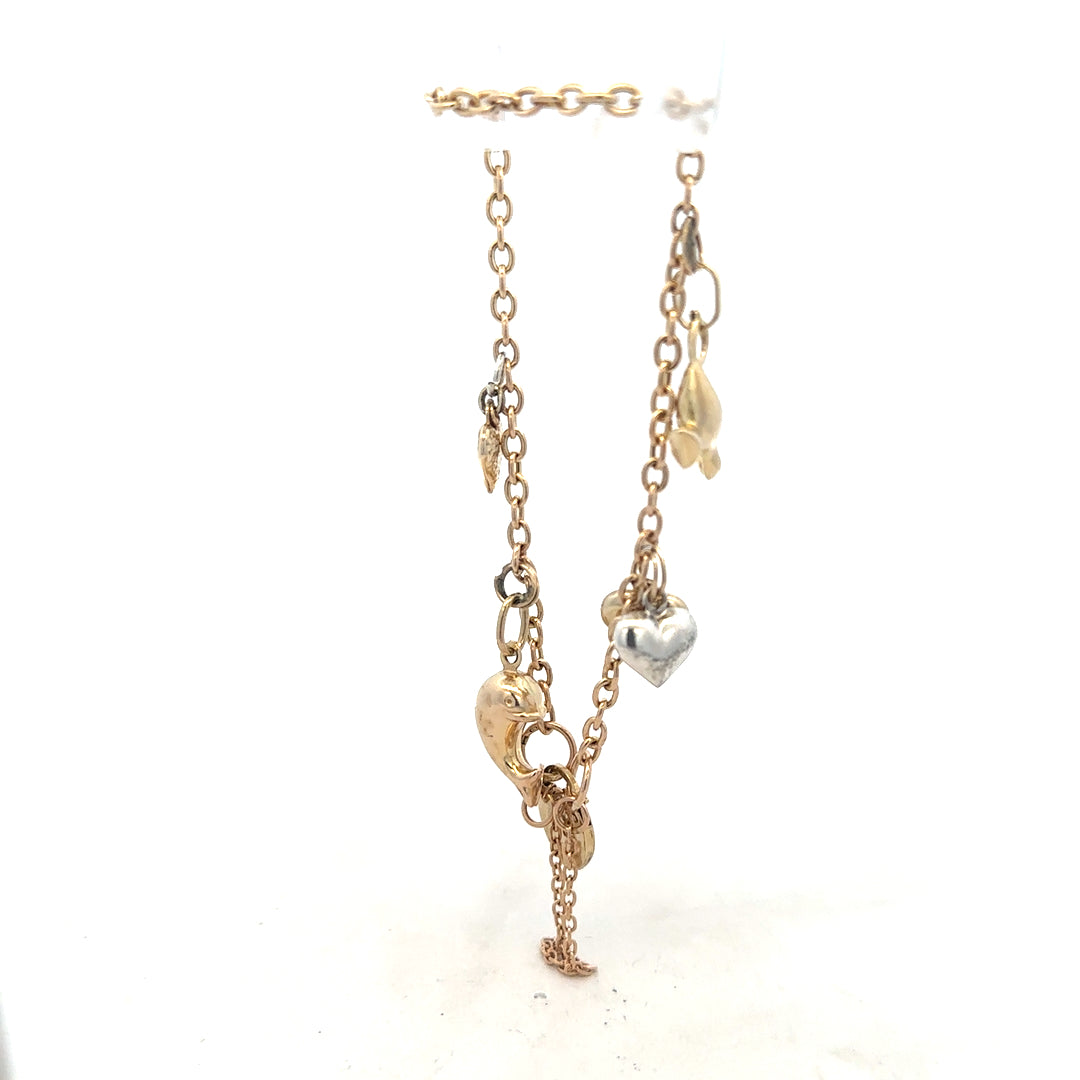 9ct yellow gold charm bracelet with intricate design, weighing 5.4g, featuring various charms on a secure clasp.
