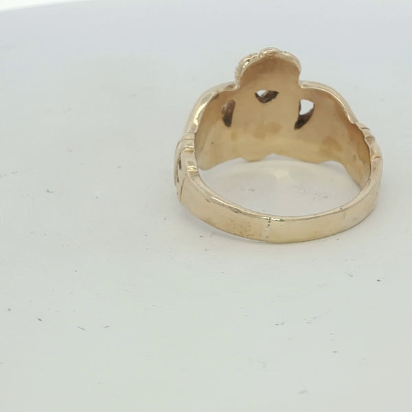 9ct yellow gold Claddagh ring with detailed heart and crown design, unbranded jewelry piece.