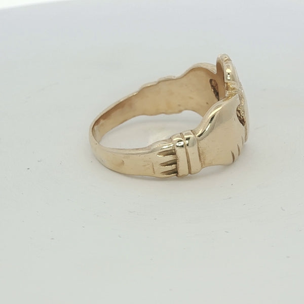 9ct yellow gold Claddagh ring with detailed heart and crown design, unbranded jewelry piece.