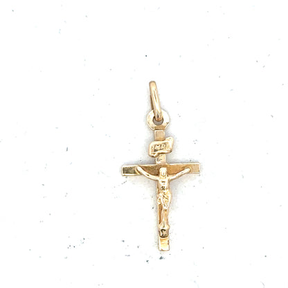9ct yellow gold cross pendant, unbranded, weighing 1.3 grams, with detailed cross design and polished finish.
