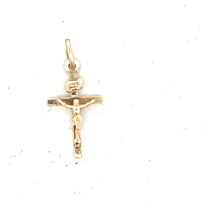 9ct yellow gold cross pendant weighing 1.3g, unbranded jewelry accessory with a classic religious design.