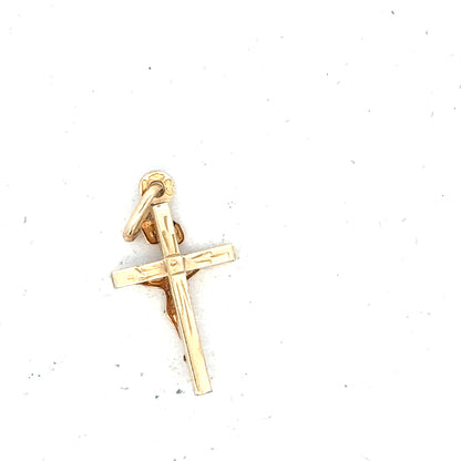 9ct yellow gold cross pendant, unbranded, weighing 1.3g, featuring a simple and elegant design in a close-up image.