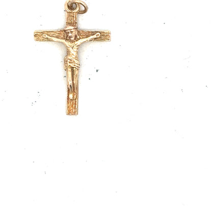 9ct yellow gold cross pendant, unbranded, with a delicate design, weighing 1.6g, displayed on a neutral background.