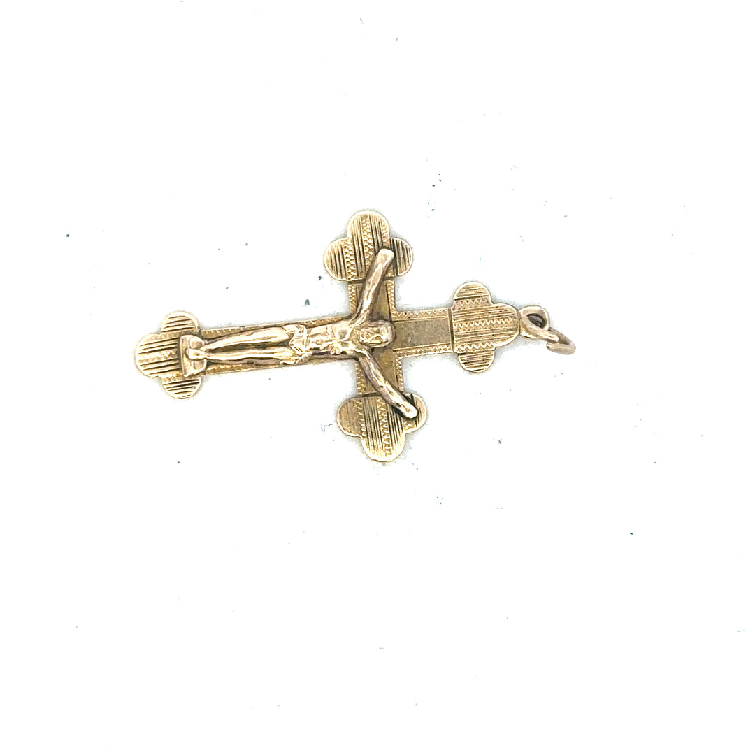 9ct yellow gold cross pendant, unbranded, weighing 2.7g, showcasing a detailed religious jewelry pendant with a polished finish.