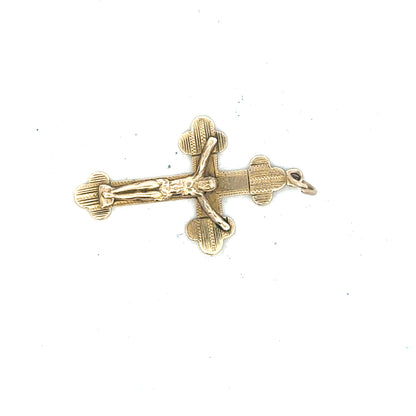 9ct yellow gold cross pendant, unbranded, weighing 2.7g, showcasing a detailed religious jewelry pendant with a polished finish.