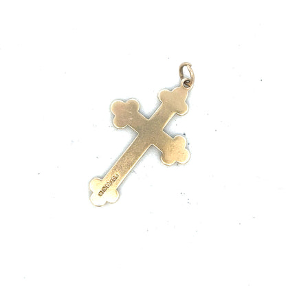 9ct yellow gold cross pendant, unbranded, weighing 2.7g, with detailed cross design, shown in a close-up image.