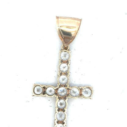 9ct yellow gold cross pendant weighing 5.1g, unbranded jewelry with a classic religious design, shown on a white background.