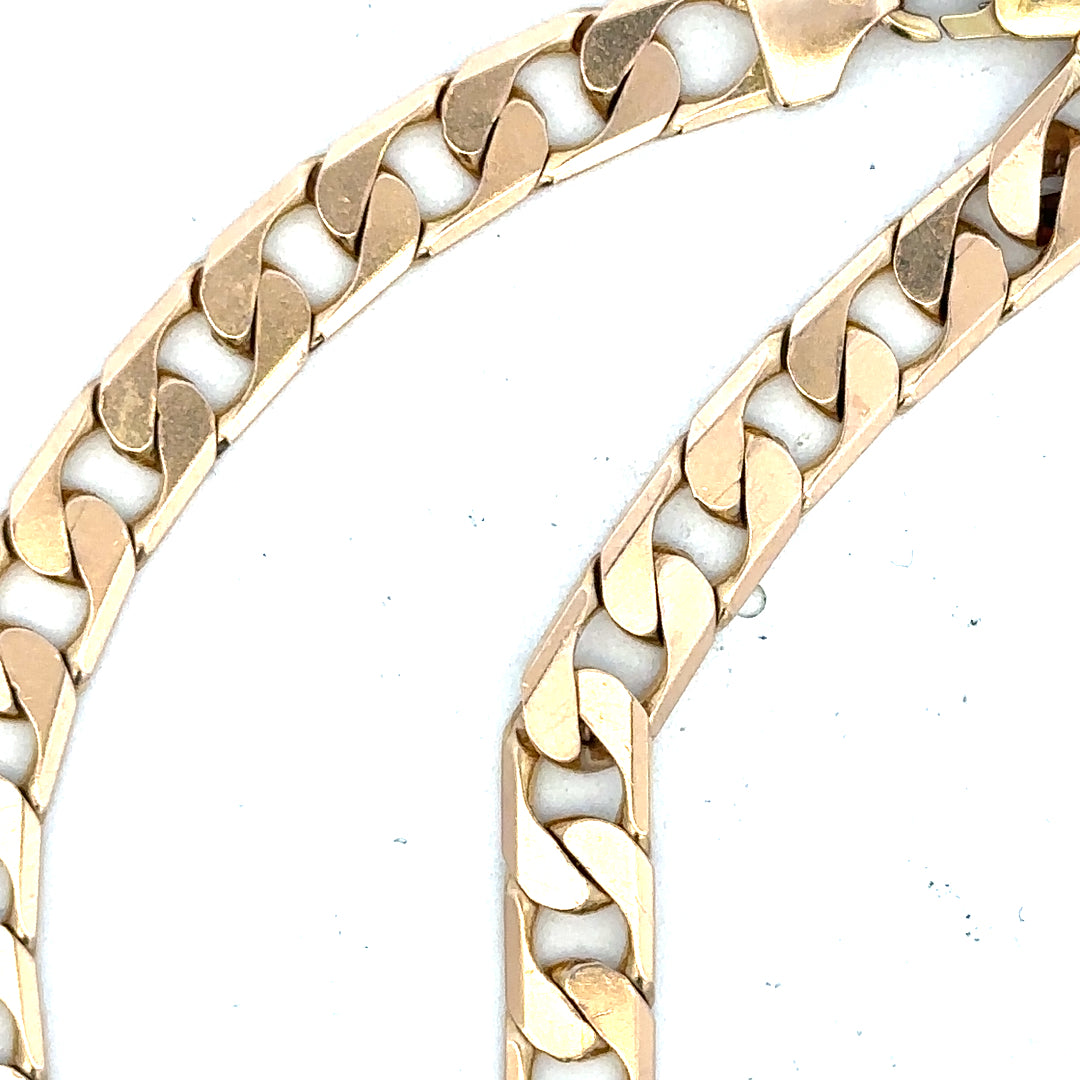 9ct yellow gold curb bracelet with a polished finish, weighing 14.5g, featuring interlinked flat oval links.