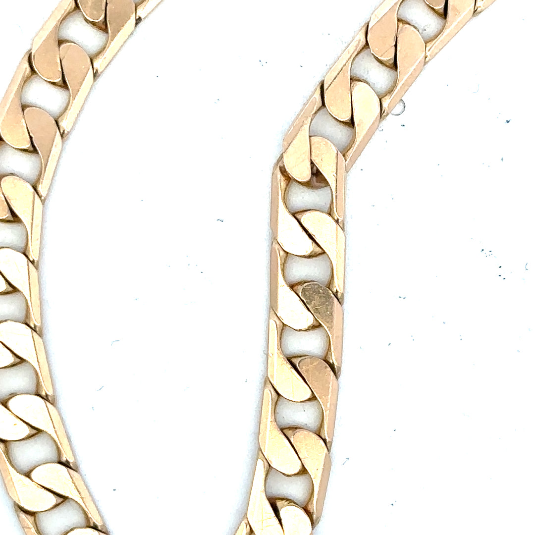 9ct yellow gold curb bracelet weighing 14.5g, unbranded jewelry with classic linked chain design.