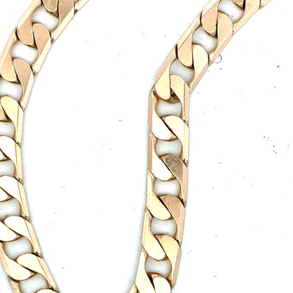 9ct yellow gold curb bracelet weighing 14.5g, unbranded jewelry with classic linked chain design.