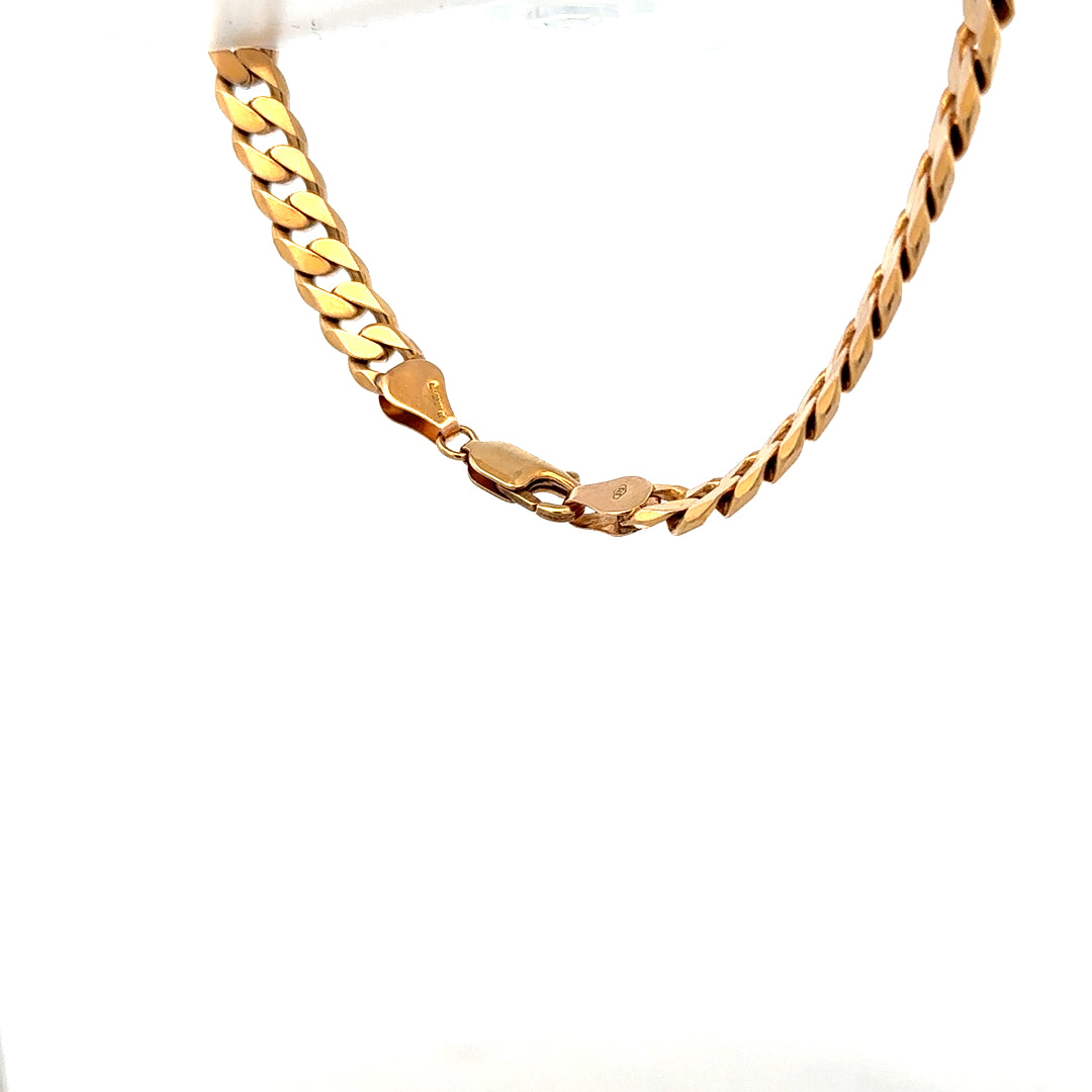 9ct yellow gold curb bracelet with a polished finish, weighs 17.1 grams, shown on a neutral background.