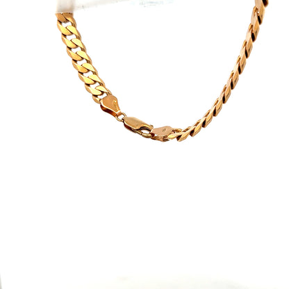 9ct yellow gold curb bracelet with a polished finish, weighs 17.1 grams, shown on a neutral background.