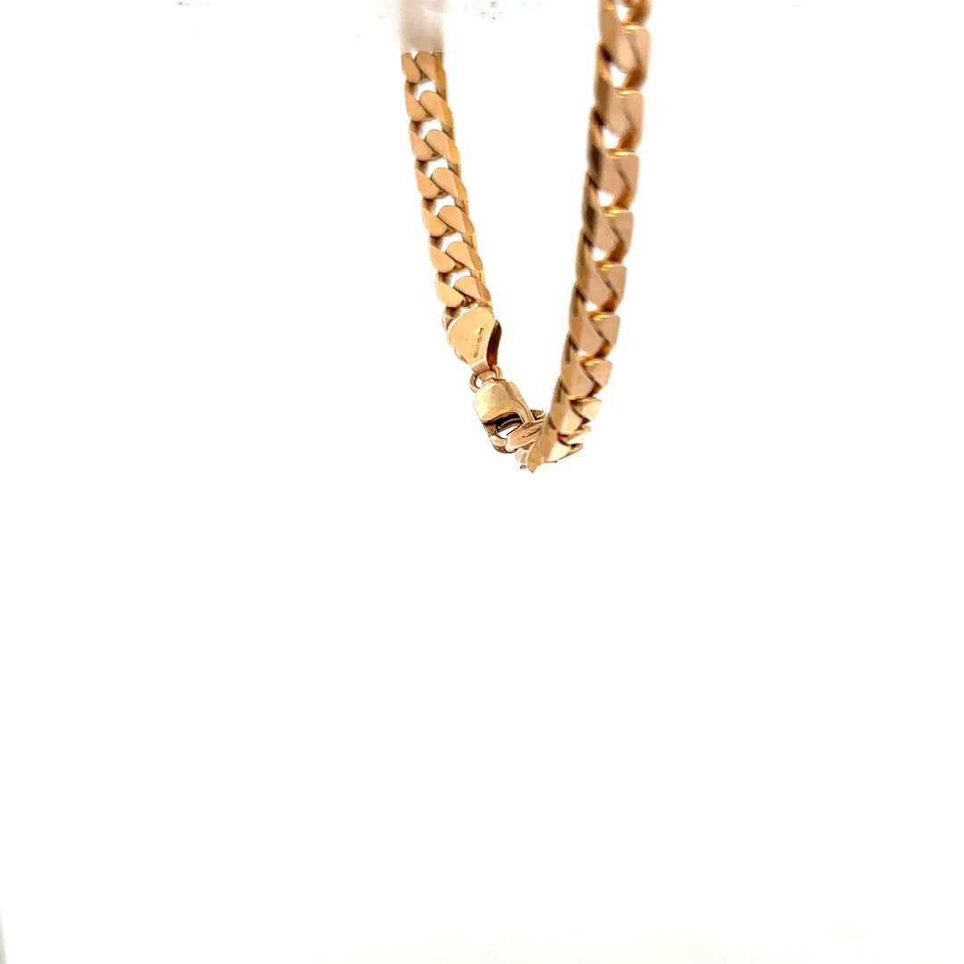 9ct yellow gold curb bracelet with a linked chain design, weighing 17.1g, featuring polished gold links.