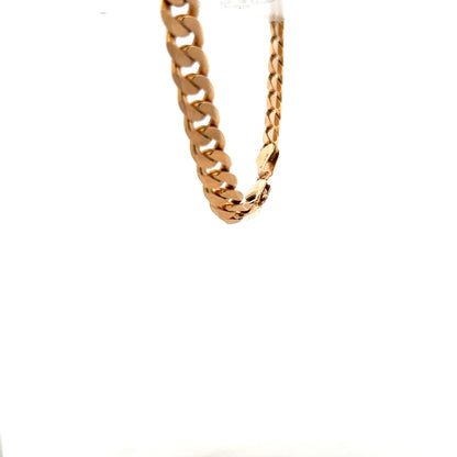 9ct yellow gold curb bracelet with a smooth chain design, weighing 17.1 grams, unbranded jewelry accessory.