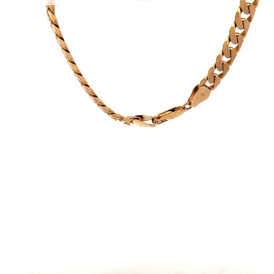 9ct yellow gold curb bracelet with a polished finish, lightweight design, and secure clasp, weighing 17.1 grams.