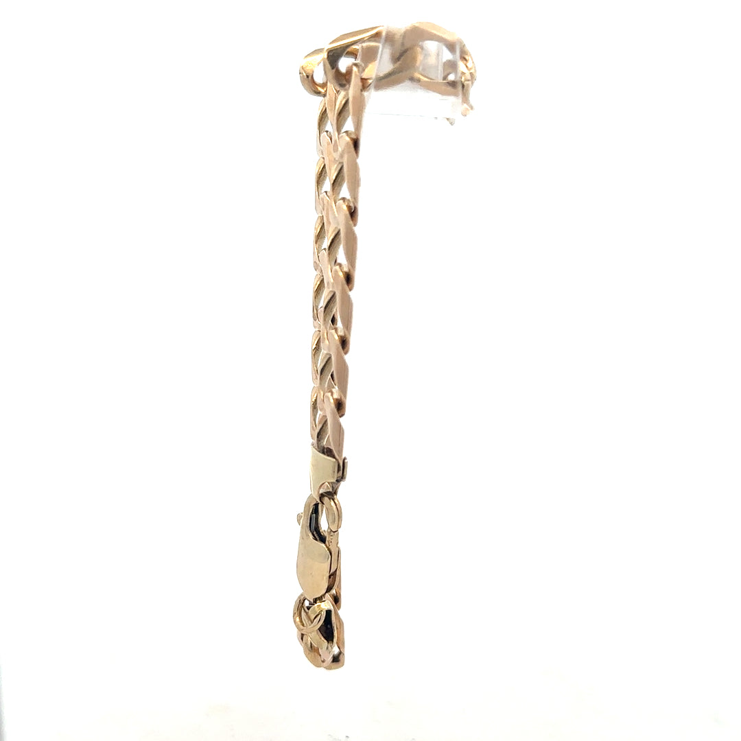 9ct yellow gold curb bracelet with a secure clasp, weighing 18.3 grams, featuring a classic chain design.