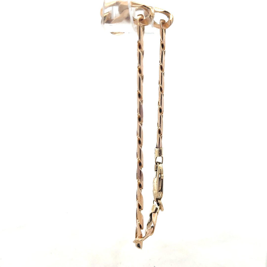 9ct yellow gold curb bracelet, unbranded, 18.3g, featuring linked gold chains, displayed on a neutral background.