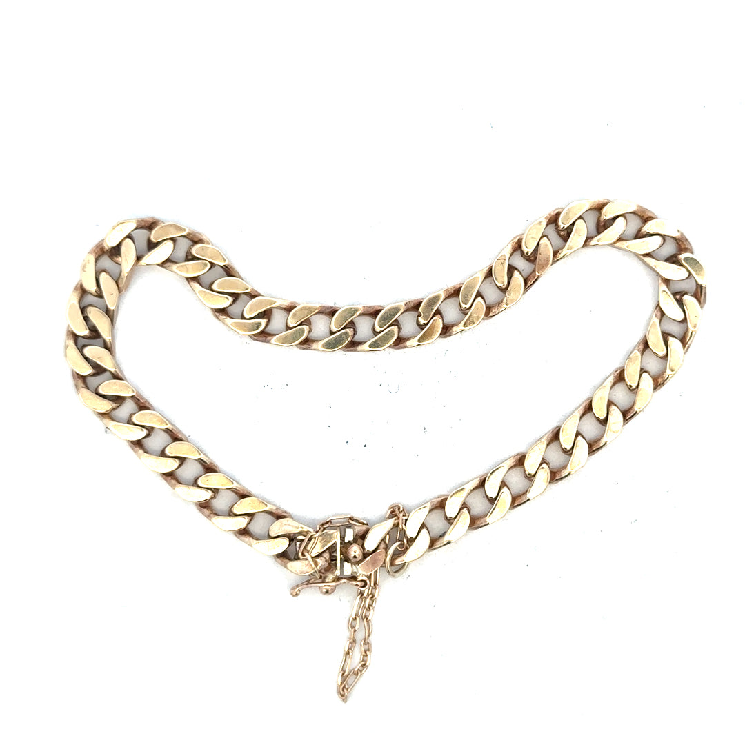 9ct yellow gold curb bracelet weighing 20g, unbranded jewelry with a classic chain style, displayed on a neutral background.